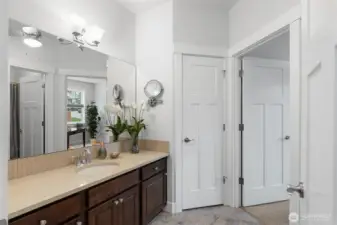 The second full bathroom can be accessed from both the hallway and the den.