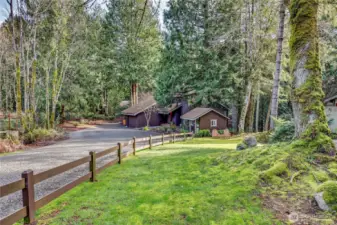 This home is set at the end of the gravel drive with ample parking and a private facade.