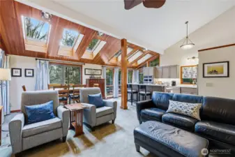 The view from the living room back towards the dining area and beautifully remodeled kitchen.