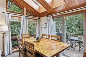 Room for dining in or dining al fresco on the beautiful back deck, accessible through the sliding glass door.