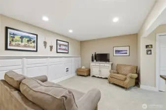 The lower level also features a family room or media room with addition space leading to the outdoors.