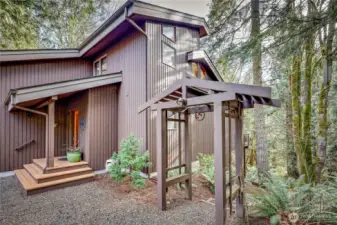 Go through the gazebo and a set of stairs will take you around the house to the lower level.