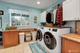 Utility room with shower on main floor.