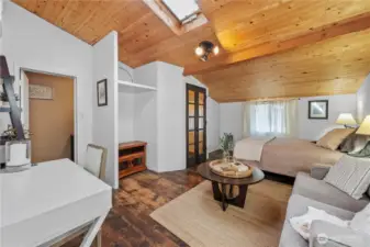 Vaulted wood ceilings with exposed beams create an inviting space.
