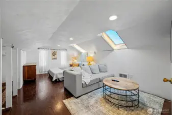 Staircase leads to a spacious open area perfect for a variety of living needs.