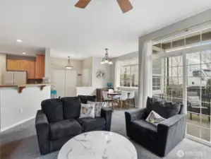 A large sliding door opens to a charming covered patio.