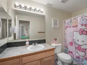 The hall bathroom has a full tub and shower.