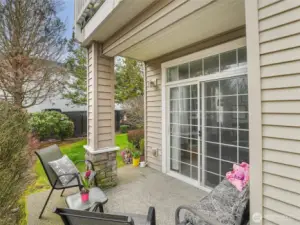 Charming outdoor covered patio is located through the living room slider.