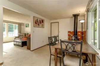 Family room with fireplace that flows into the living room.