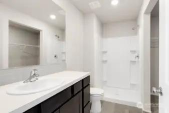 Primary bathroom with large walk-in shower and walk-in closet! Photos are for representational purposes only. Colors and options may vary.