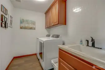 Convenience upstairs laundry room with new flooring
