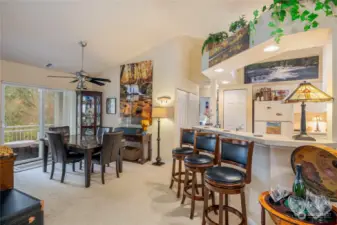 Bright kitchen and breakfast bar, with dining nearby