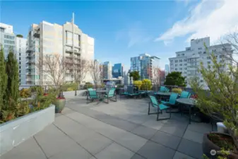 Large seating area rooftop deck.