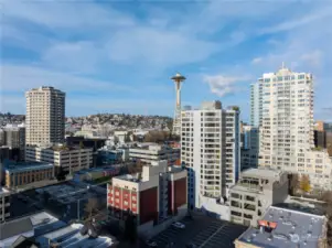 Drone front view of Harbour Heights condo with Space Needle and background.