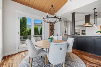 Dining area with French doors that go out onto the deck.