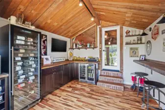 This boathouse wine-beverage room also features a small deck, 2 temperature controlled refrigerators, bar, TV's etc. This is a fun space with a view!