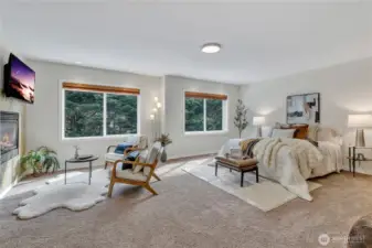 Double-door entry opens to the expansive, elegant primary suite, complete with a luxurious see-thru fireplace featuring a granite surround. Enjoy picturesque, private views of the serene dedicated wetlands from this peaceful retreat.
