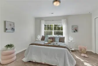 Another of the five spacious bedrooms, offering comfort and flexibility for family or guests. The closet offers some built-in storage.