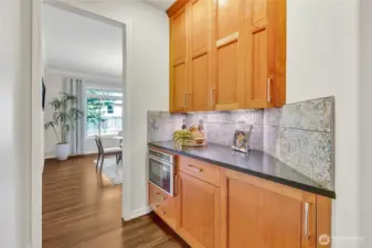 Convenient butler's pantry off the dining room, featuring a built-in microwave for added functionality and ease.