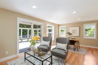Spacious and bright, this secondary living area offers the perfect spot for reading, relaxing, or entertaining guests.