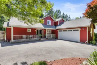 Ample parking and a spacious two-car garage offer convenience and functionality in a beautifully designed exterior.