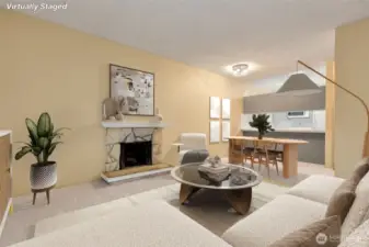 Living area with adjoining dining space. Passthrough from the kitchen to the dining area. (virtually staged)