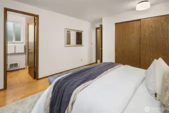 Primary bedroom showing 3/4 ensuite and full size closet
