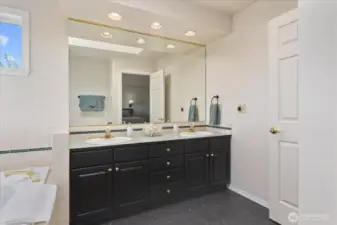 5 piece primary bath with new vinyl floor.