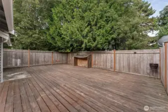 Fully enclosed back deck is perfect for entertaining or just relaxing.