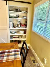 Clever storage cabinet in dining room.
