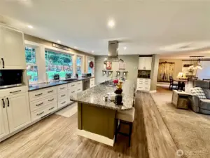 Another view of kitchen with amazing storage and the perfect charging spot too.