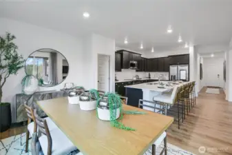 Dining to Kitchen- Huge island and a Pantry the size of a bedroom!