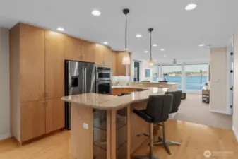 Designed for effortless entertaining, the well-planned out kitchen is the heart of the home. Hardwood floors, upgraded appliances, an open-concept layout, and sweeping views of the city and Sound combine to deliver a truly exceptional living experience.