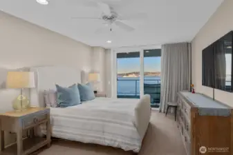 Stepping into the Primary Suite, you’ll be greeted by floor-to-ceiling windows framing breathtaking views of the city and Puget Sound, where the ever-moving ferries add a dynamic rhythm to the scenery. Imagine waking up each morning to this stunning panorama!