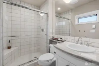 The second en-suite bedroom features a 3/4 bath—ideal for visiting guests!