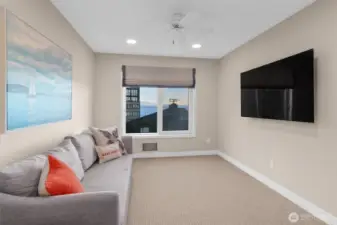 Versatile and functional, this home office is presently arranged as a media room.