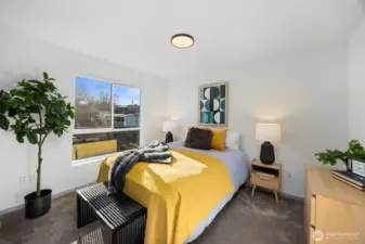 A second bedroom on the third level provides flexible space for guests or a home office.