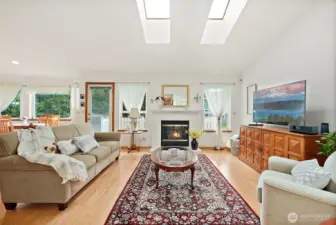 Living room boosted with vaulted ceiling and gas fireplace