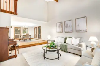 Airy formal living and dining spaces with vaulted ceilings, open sightlines, and big windows that pull in natural light—perfect for gatherings that flow easily from conversation to the dinner table.