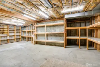 550 sq ft of unfinished space with walls of built-in shelving—perfect for bulk storage, gear, or a future workshop.