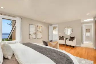 The primary bedroom suite takes in natural light and commanding views.