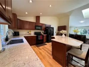 Beautiful quartz counters and soft close cabinetry in the kitchen.