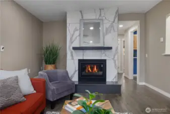 Gorgeous tiled gas fireplace with mantle make this room extra cozy.