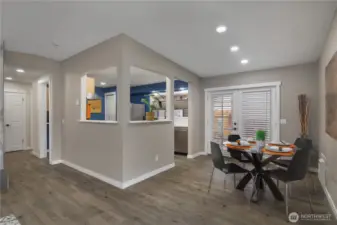 Dining area with french doors leading out to 1 of 2 covered outdoor spaces.