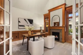 Cozy main level Den features a gas fireplace and floor to ceiling built ins.