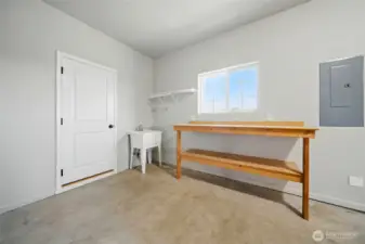 Garage work/hobby area with utility sink