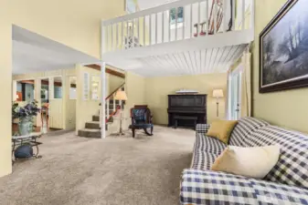 Living room with stair case to 2nd floor .