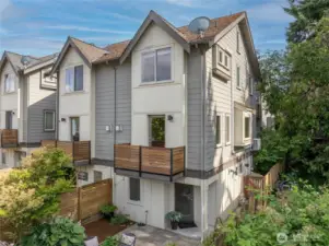 This townhouse is the south end unit, with three walls of windows to get all the light. Notice the large fully-fenced patio.
