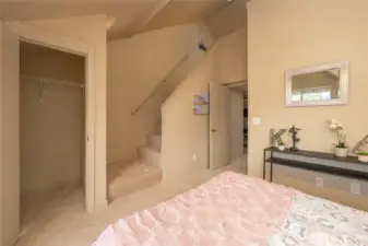 Walk-in closet and stairs to the loft space.