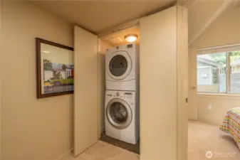 Large washer/dryer combo in a closet on the upper floor right next to the bedrooms. A light and whole house fan in there as well.